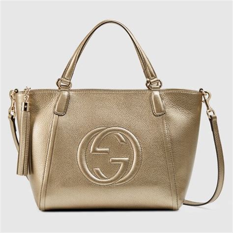 Soho metallic leather top handle bag in golden beige metallic 